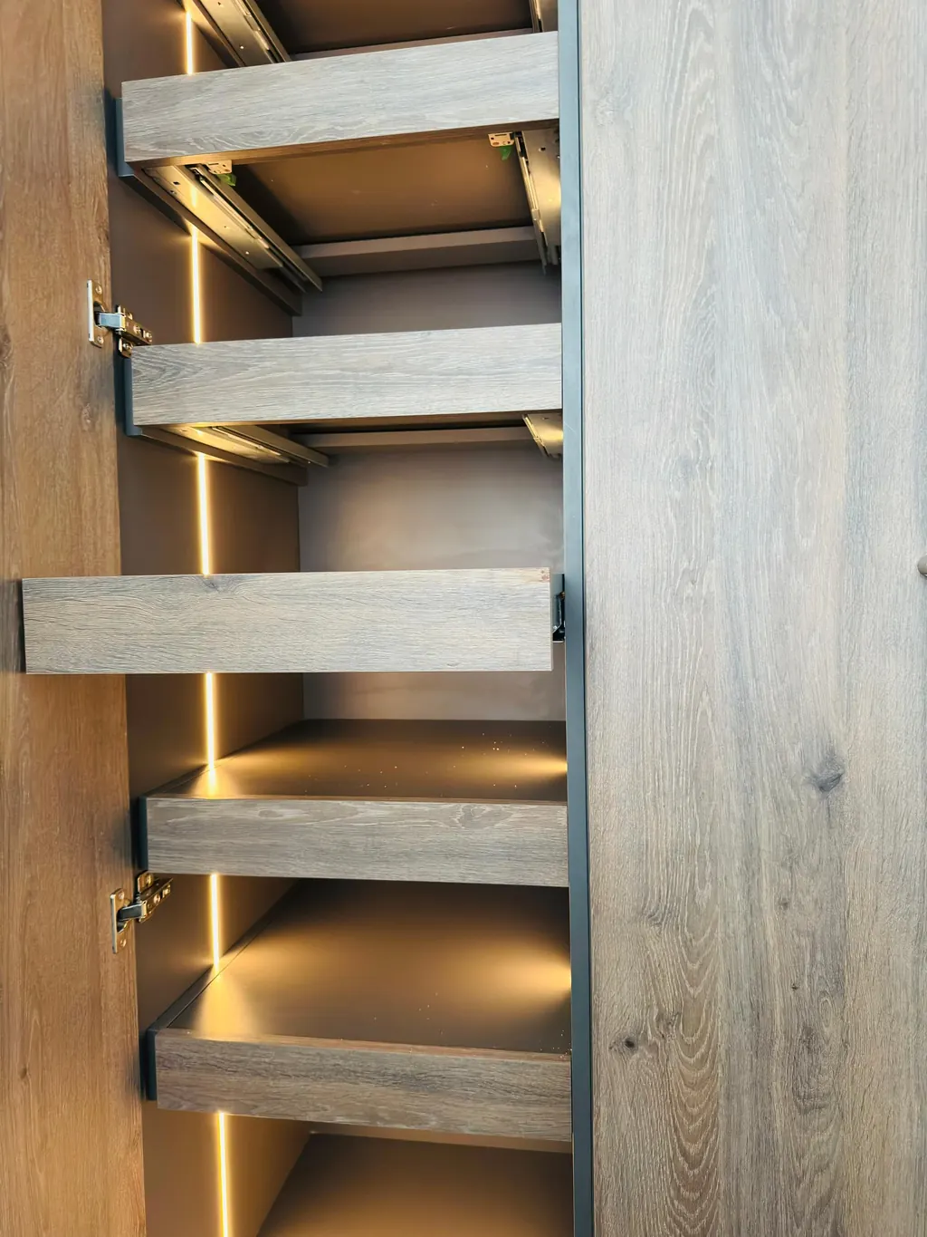 Full-height oak-look wardrobe with lit interior shelves