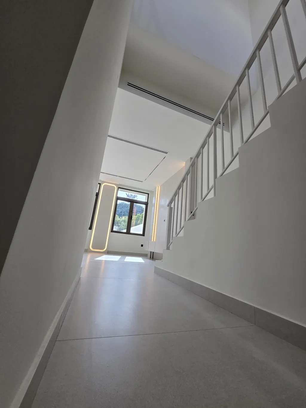 Hall beside the staircase after the renovation, looking to the window